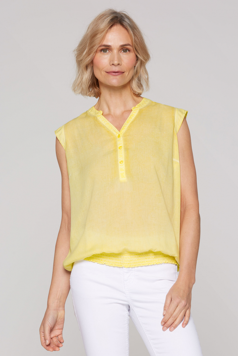 Ärmellose Bluse mit gesmoktem Saum und Rückenprint